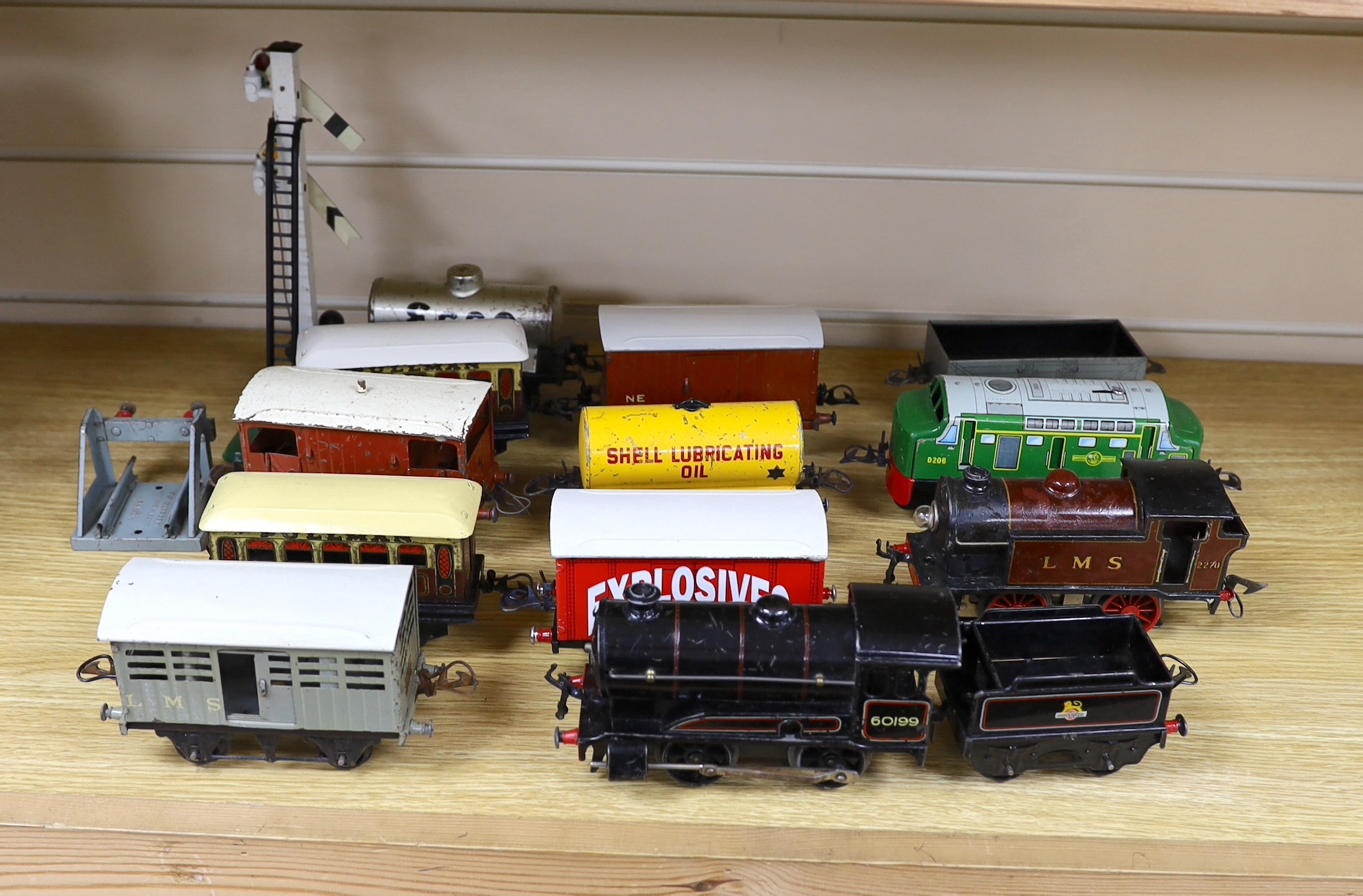 Thirteen Hornby 0 gauge tinplate items including; a clockwork 0-4-0 tender loco, 60199, a 20v electric 0-4-0T loco, 2270, an electric 0-4-0 diesel loco by another maker, marked Made in Great Britain, together with seven